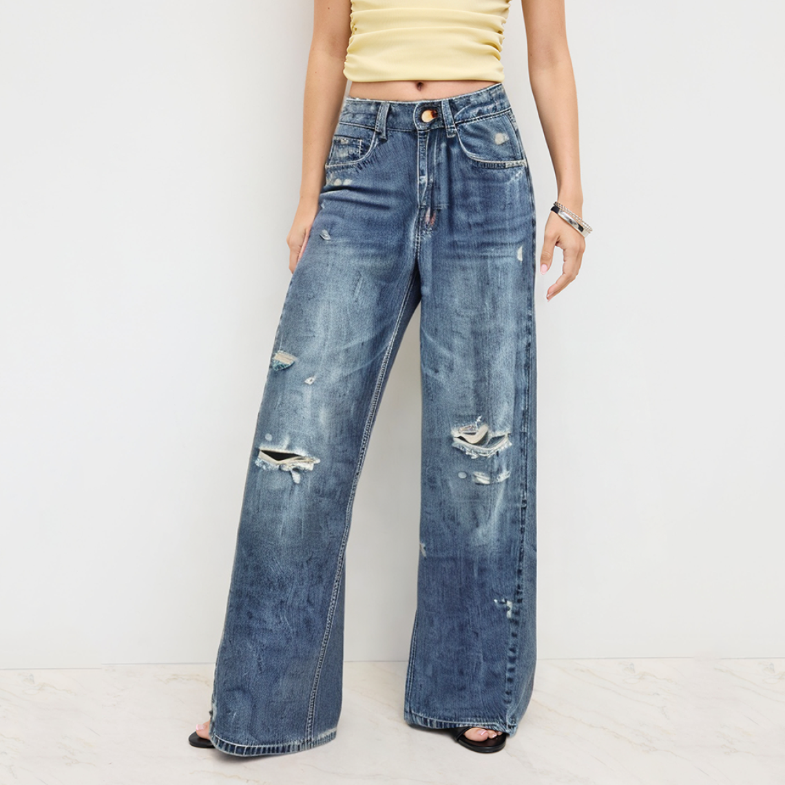 Washed and worn high waist women's denim trousers